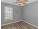 Bedroom featuring wood floors and a bright window at 125 Balsa Dr., Longs, SC 29568