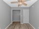 A well-lit bedroom with closet and ceiling fan at 125 Balsa Dr., Longs, SC 29568