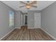 A bedroom featuring wood floors, a ceiling fan and two closets at 125 Balsa Dr., Longs, SC 29568
