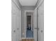 Hallway view of blue tile and closet space at 125 Balsa Dr., Longs, SC 29568