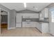 Bright kitchen features white appliances, ample counter space, and tile flooring at 125 Balsa Dr., Longs, SC 29568
