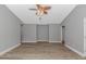 Spacious living room featuring modern wood floors and a ceiling fan with light fixture at 125 Balsa Dr., Longs, SC 29568