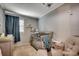 This bedroom features a crib, a nursing chair, and a dresser at 1261 Parkhill Dr., Conway, SC 29526