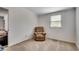 Neutral bedroom featuring a plush armchair and bright natural light from the window at 1261 Parkhill Dr., Conway, SC 29526