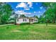 Charming home featuring a cozy porch, lush lawn, and a convenient carport at 1261 Parkhill Dr., Conway, SC 29526
