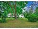 View of house with an mature tree in the yard and lush green landscape at 1261 Parkhill Dr., Conway, SC 29526