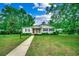 Charming one-story home with a well-manicured lawn, walkway and beautiful landscape at 1261 Parkhill Dr., Conway, SC 29526