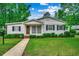 Charming one-story home with a well-manicured lawn, walkway and beautiful landscape at 1261 Parkhill Dr., Conway, SC 29526
