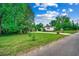 Quaint home with well-manicured lawn and mature trees, offering a serene and inviting curb appeal at 1261 Parkhill Dr., Conway, SC 29526