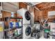 Functional garage space with a stacked washer and dryer unit and storage shelves at 1261 Parkhill Dr., Conway, SC 29526