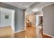 This hallway showcases wood floors and multiple entryways into the various rooms of the house at 1261 Parkhill Dr., Conway, SC 29526