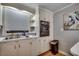 This kitchen features white cabinets, an oven, a double basin sink, and a peacock painting on the wall at 1261 Parkhill Dr., Conway, SC 29526