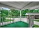 Outdoor porch area with view of a driveway, carport, and green trees at 1261 Parkhill Dr., Conway, SC 29526