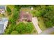 Aerial view of the home showcasing lush landscaping, circular driveway, and neighborhood at 127 Pinfeather Trail, Myrtle Beach, SC 29588
