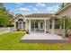 Charming back deck and yard featuring a white picket fence and mature landscaping at 127 Pinfeather Trail, Myrtle Beach, SC 29588
