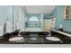 Bright bathroom with granite counters, double sinks, bathtub, and separate glass-enclosed shower at 127 Pinfeather Trail, Myrtle Beach, SC 29588