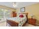 Bedroom with ceiling fan, natural lighting, and wooden furniture at 127 Pinfeather Trail, Myrtle Beach, SC 29588