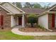 Welcoming front exterior with brick and siding, complemented by a landscaped yard and walkway at 127 Pinfeather Trail, Myrtle Beach, SC 29588