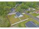 Aerial view of a home with a fenced-in backyard, patio furniture, and lush landscaping at 1307 Collins Park St., Conway, SC 29526