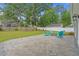 Backyard showing a brick paver patio with Adirondack chairs around the fire pit at 1307 Collins Park St., Conway, SC 29526