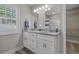Well-lit bathroom with double sinks and granite countertops at 1307 Collins Park St., Conway, SC 29526