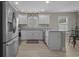 Bright kitchen with stainless steel appliances, white cabinetry, and granite countertops at 1307 Collins Park St., Conway, SC 29526