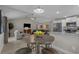 Open-concept living space featuring modern flooring, an adjacent kitchen, and comfortable living area at 1307 Collins Park St., Conway, SC 29526