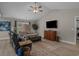 Cozy living room featuring luxury vinyl flooring, vaulted ceiling, and comfortable seating arrangement at 1307 Collins Park St., Conway, SC 29526