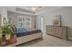 Spacious primary bedroom features a tray ceiling, lots of natural light and ensuite access at 1307 Collins Park St., Conway, SC 29526