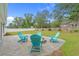Brick paver patio with Adirondack chairs create the perfect place to relax at 1307 Collins Park St., Conway, SC 29526