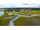 Gorgeous aerial view of waterway, green golf course, bridge and beautiful homes at 141-4 Weehawka Way # 4, Pawleys Island, SC 29585