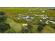 Beautiful aerial of golf course featuring bridge over marsh at 141-4 Weehawka Way # 4, Pawleys Island, SC 29585
