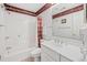 Bathroom with a shower-tub combo, toilet, and vanity with mirror and decorative wallpaper trim at 141-4 Weehawka Way # 4, Pawleys Island, SC 29585