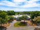 An impressive clubhouse surrounded by lush greenery and a tranquil pond at 141-4 Weehawka Way # 4, Pawleys Island, SC 29585