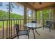Screened-in porch featuring a table and chairs, overlooking the golf course at 141-4 Weehawka Way # 4, Pawleys Island, SC 29585