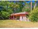 Spacious backyard featuring a covered patio, perfect for outdoor entertaining and relaxation at 152 Gateway Dr., Little River, SC 29566