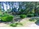 Large, well-manicured backyard with lush greenery and mature trees providing ample shade at 152 Gateway Dr., Little River, SC 29566