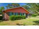 Landscaped lawn view of brick house with windows and shrubs at 152 Gateway Dr., Little River, SC 29566