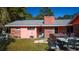 Backyard view of the house with a hot tub and patio furniture on the lawn at 152 Gateway Dr., Little River, SC 29566
