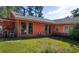 Charming home with large windows, a screened-in porch, and a well-maintained lawn at 152 Gateway Dr., Little River, SC 29566
