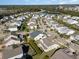 An aerial view of a residential neighborhood with a pond and lush landscaping at 1549 Kensington Ln., Myrtle Beach, SC 29577