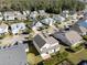 Aerial view of a residential neighborhood with manicured lawns and mature trees at 1549 Kensington Ln., Myrtle Beach, SC 29577