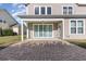 The covered back patio features a brick patio and large sliding glass doors at 1549 Kensington Ln., Myrtle Beach, SC 29577
