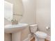 Neat half bathroom features a pedestal sink and classic fixtures at 1549 Kensington Ln., Myrtle Beach, SC 29577