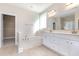 Bathroom featuring double sinks and a walk in shower at 1549 Kensington Ln., Myrtle Beach, SC 29577