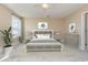 Inviting bedroom featuring a ceiling fan, neutral walls, and ample natural light at 1549 Kensington Ln., Myrtle Beach, SC 29577