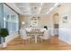 Bright dining room boasts modern lighting, coffered ceilings, and a large window overlooking the yard at 1549 Kensington Ln., Myrtle Beach, SC 29577