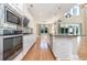 Modern kitchen with stainless steel appliances, granite countertops, and hardwood floors at 1549 Kensington Ln., Myrtle Beach, SC 29577