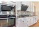 Close-up of kitchen with granite countertops, tiled backsplash, and stainless steel appliances at 1549 Kensington Ln., Myrtle Beach, SC 29577
