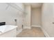 Functional laundry room with ample space and utility sink at 1549 Kensington Ln., Myrtle Beach, SC 29577